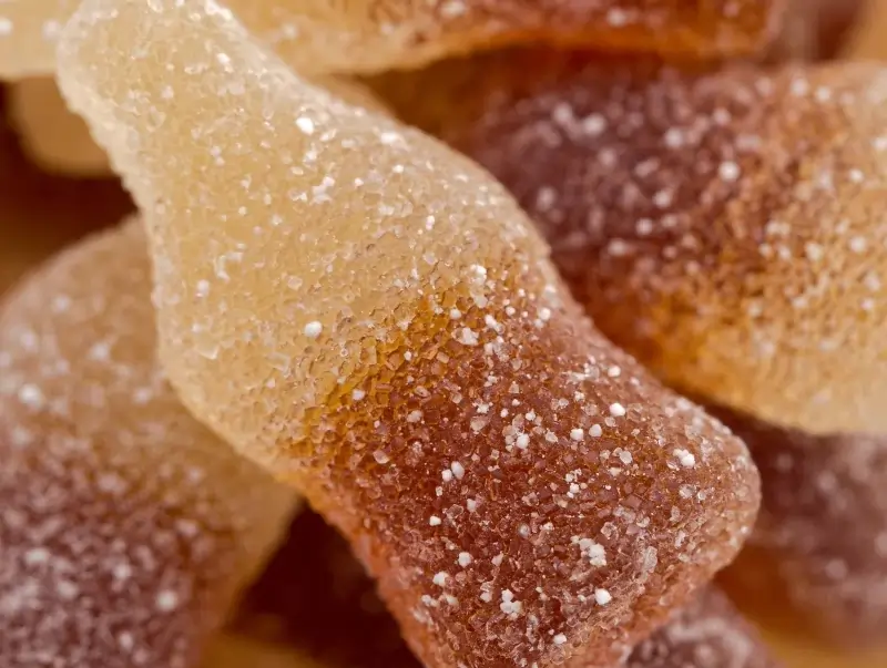 Coca cola gummy bear representing candy vape flavor range that will be in increased regulatory scrutiny